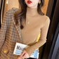 Fitted ribbed mock neck sweater in a quiet macaron tone shown close up on a model