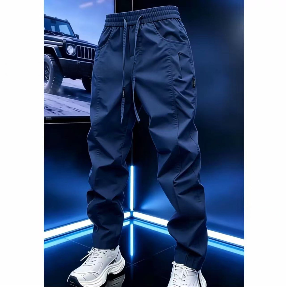 Navy drawstring jogger pants with elastic waist and tapered legs, size 36 option