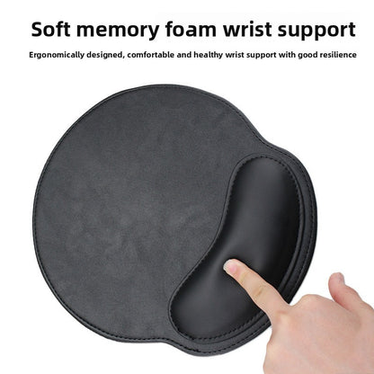 Round leather look mouse pad with a memory foam wrist rest bolster in dark gray