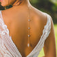Back drape body chain worn low on a bare back