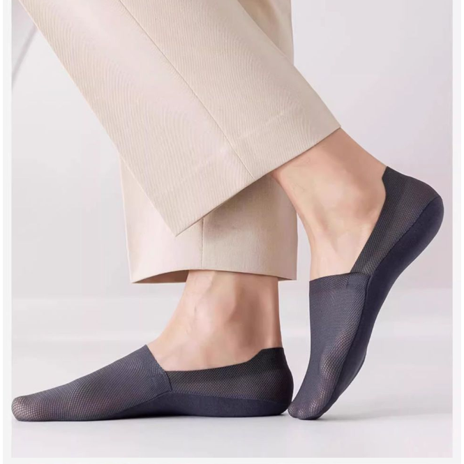 Solid color low cut mesh boat sock shown flat to show the invisible cut
