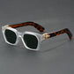 Square sunglasses with a blue to yellow gradient lens and gold temple arrowhead, side view