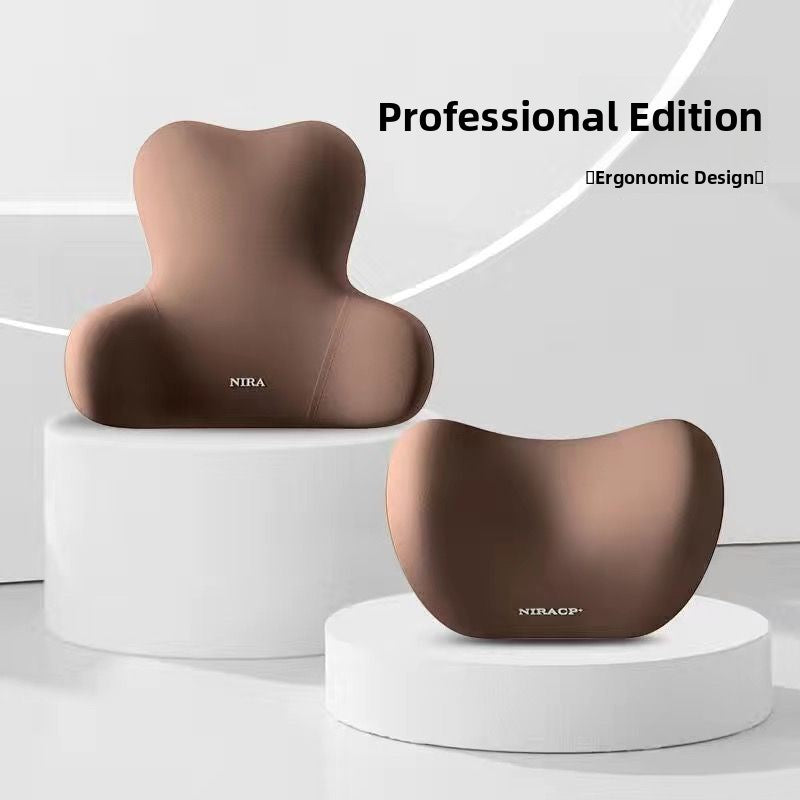 Brown contoured lumbar back cushion and neck headrest pair on white podium