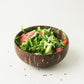 Mini coconut shell bowl filled with salad, grapefruit and avocado, Mini bowl option photo