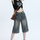 Retro denim shorts on a clean studio background, full view