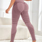 Seamless high waist yoga leggings shown from the back with a smooth ruched seat