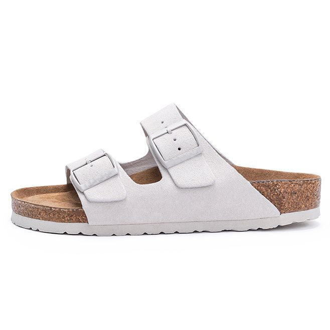 rubber outsole of a pink cork slide sandal seen from below