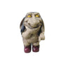 Troll statue on a white background showing full front detail and yellow eyes