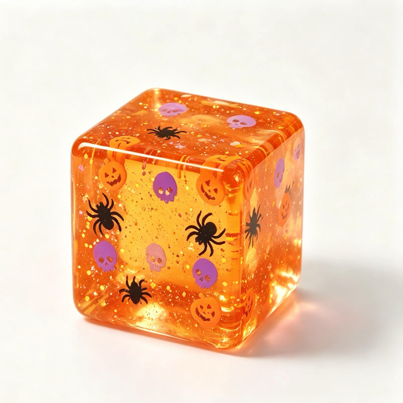 Halloween glitter squishy cube squeezed to show the soft slow rebound thermoplastic body