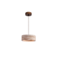 Rounded travertine stone pendant light on a slim cord in a warm wabi sabi interior