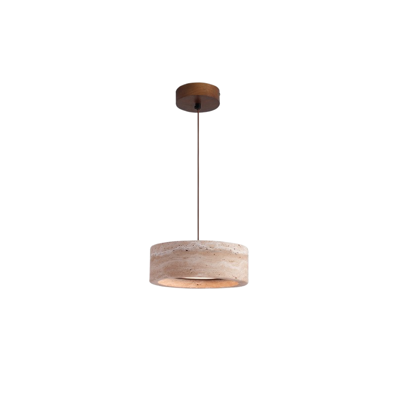 Rounded travertine stone pendant light on a slim cord in a warm wabi sabi interior