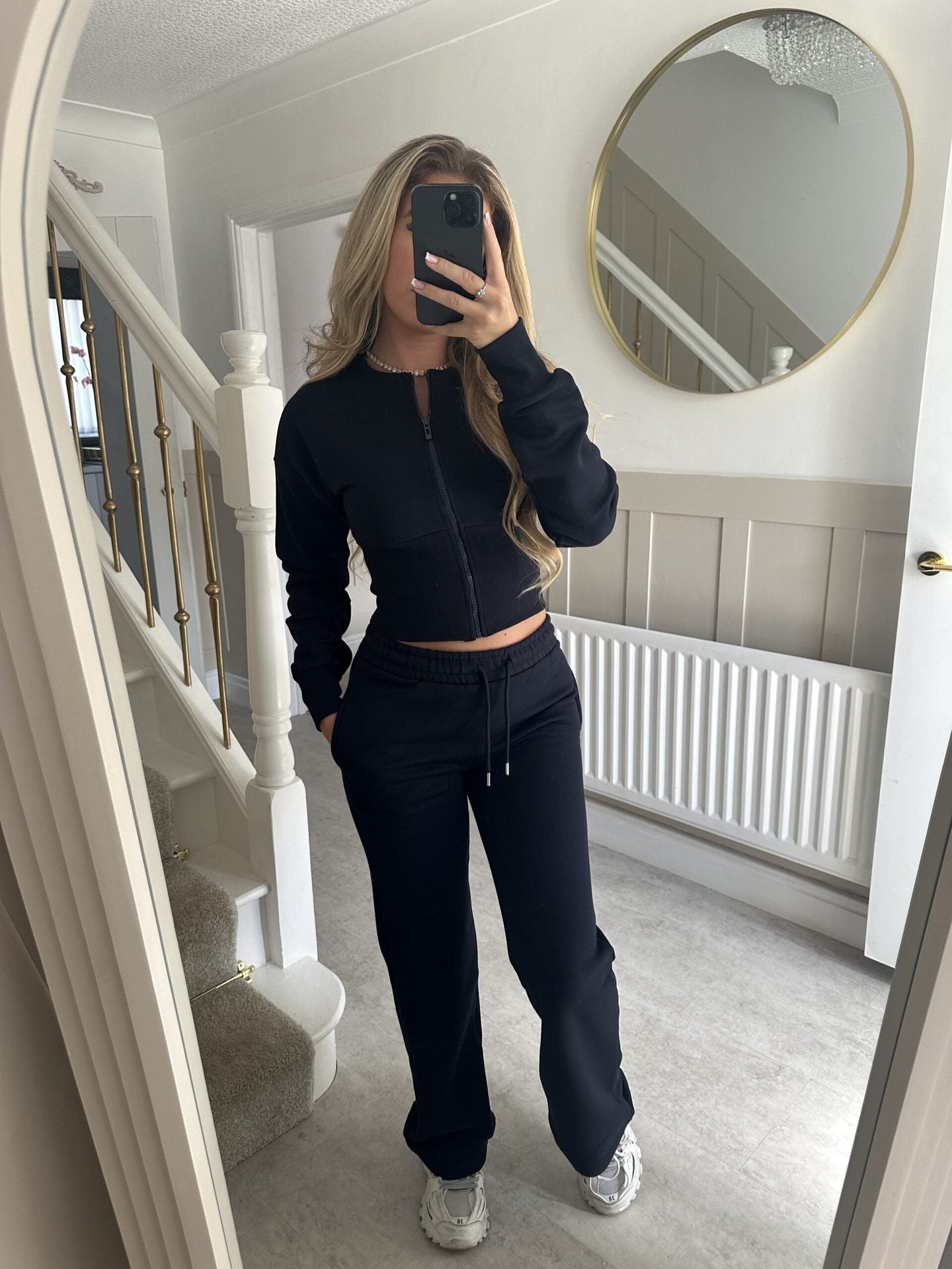 Womens two piece lounge set, a front zip jacket and straight leg drawstring pants in a soft sweat knit