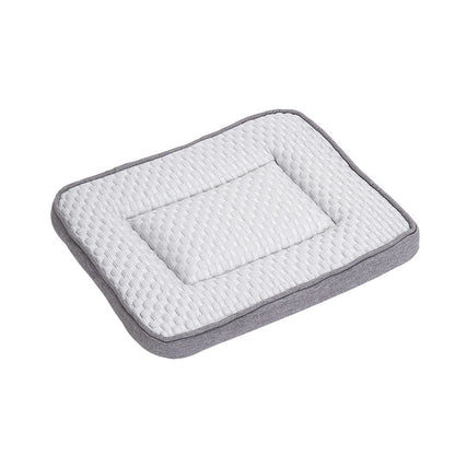 Hand pressing the padded pet cooling mat to show the soft quilted fabric and scale