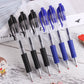 Row of black and blue retractable gel pens with rubber grips on a wooden desk