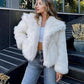 Cropped vegan faux fur jacket with a large shawl collar and soft polyester fur pile