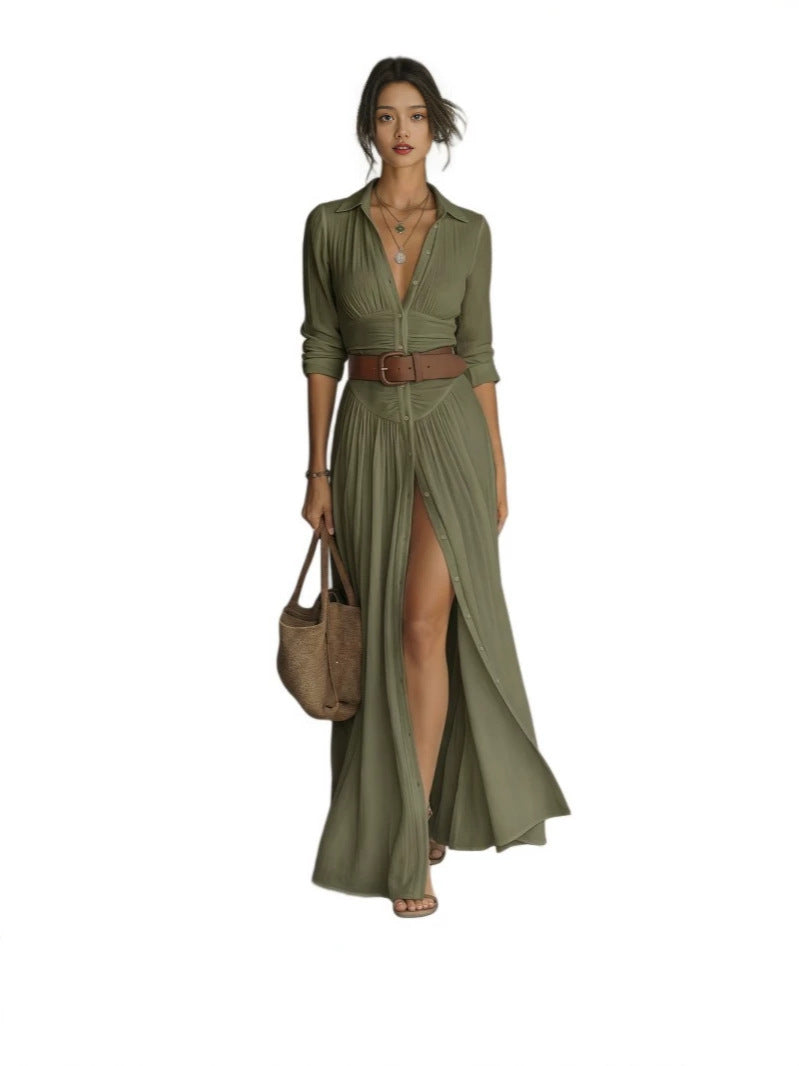 Dark green long shirt dress with collar, plunging neckline and brown belt on a plain white background