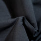Vest worn beneath buttoned shirt for late métro commute