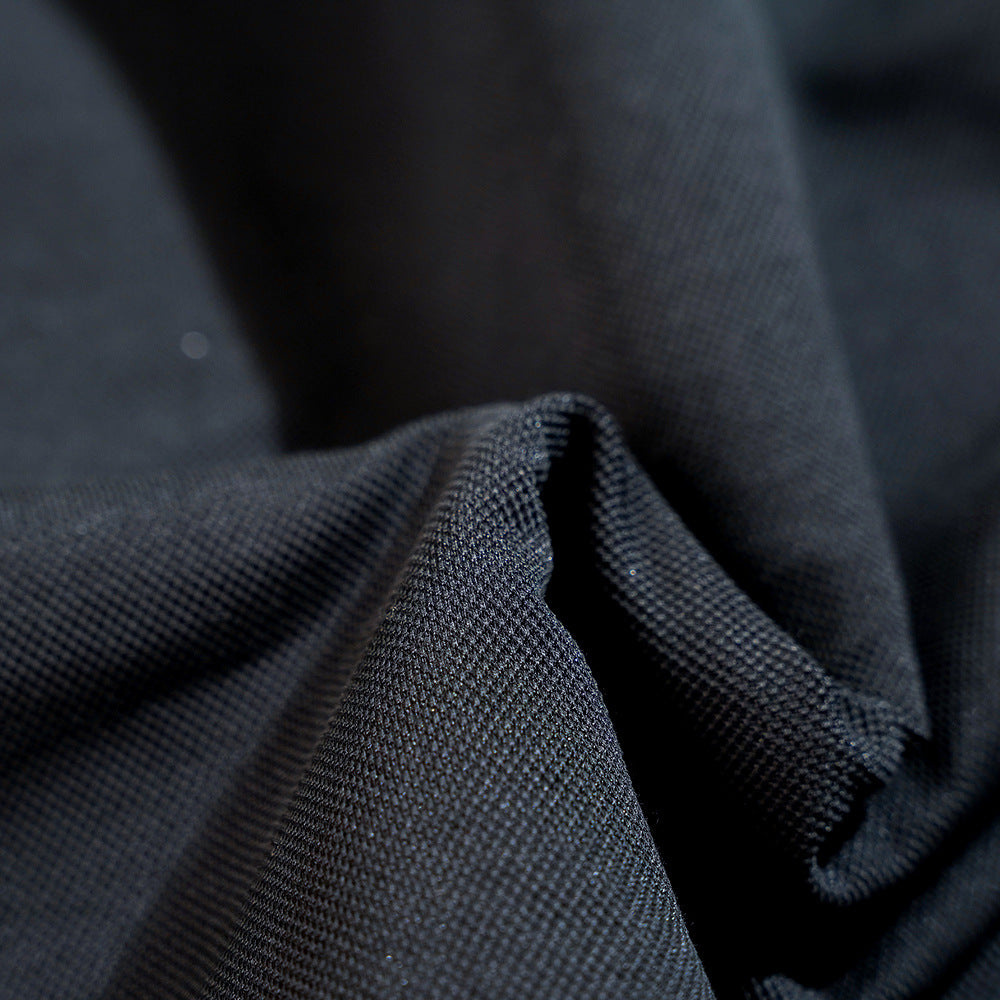 Vest worn beneath buttoned shirt for late métro commute