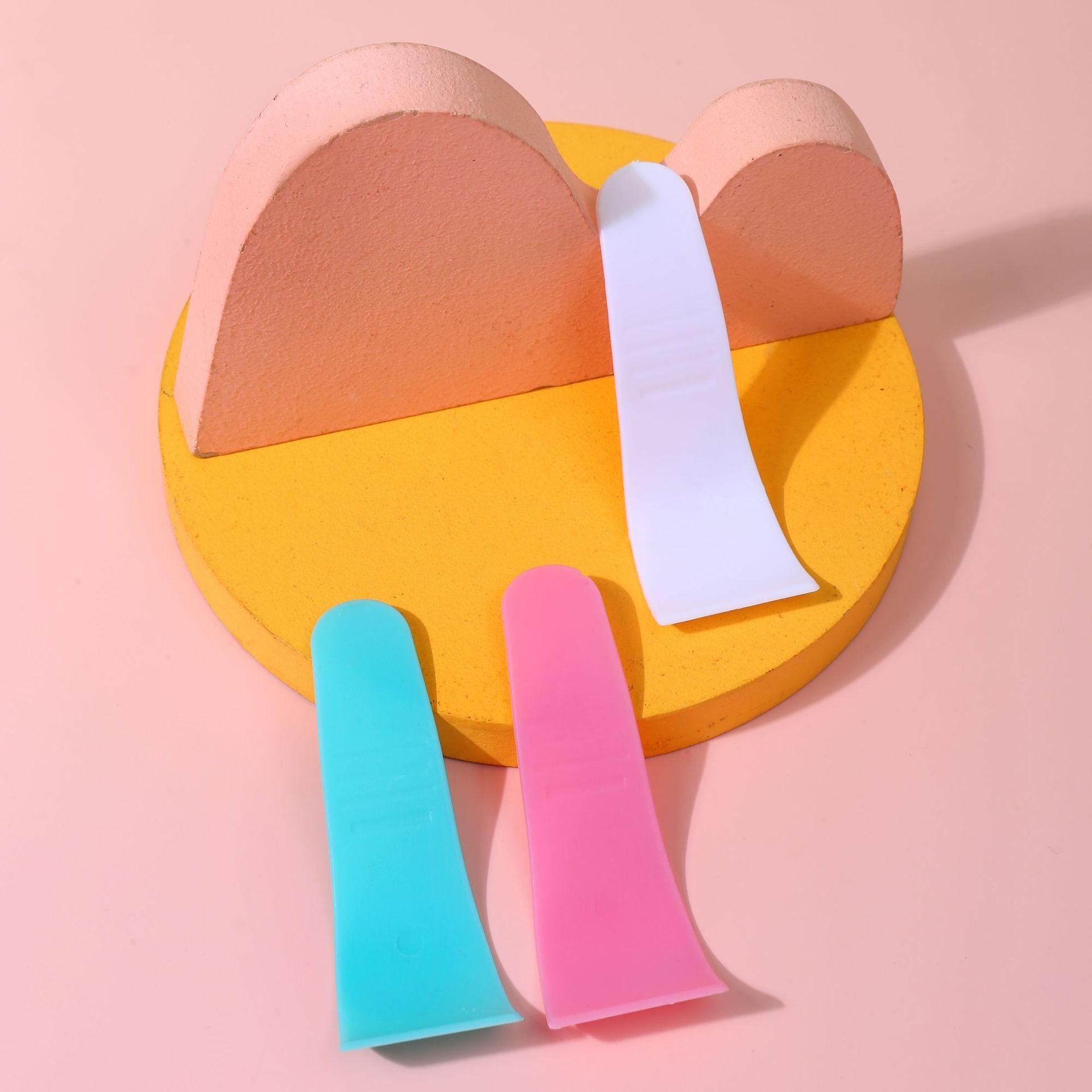 Hair removal cream applicator spatula in white PP plastic shown from the side
