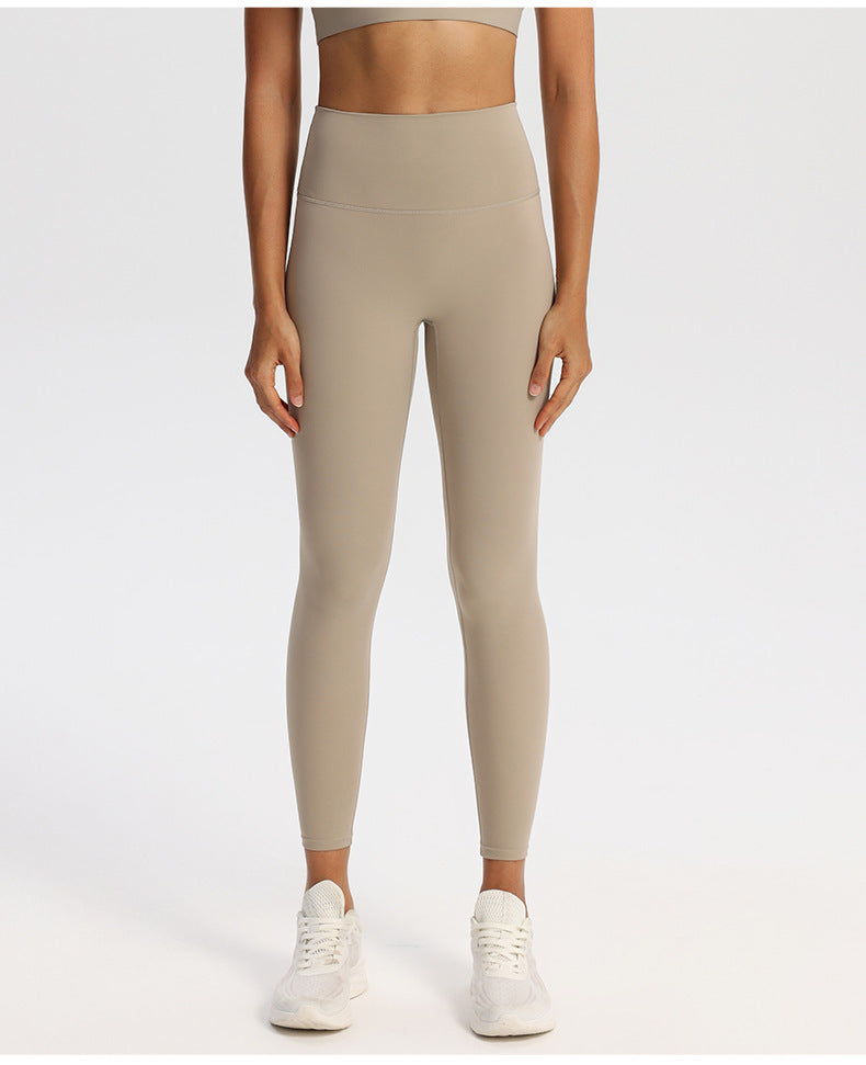 Matte finish high-waisted yoga leggings for women, ankle length, on a standing model