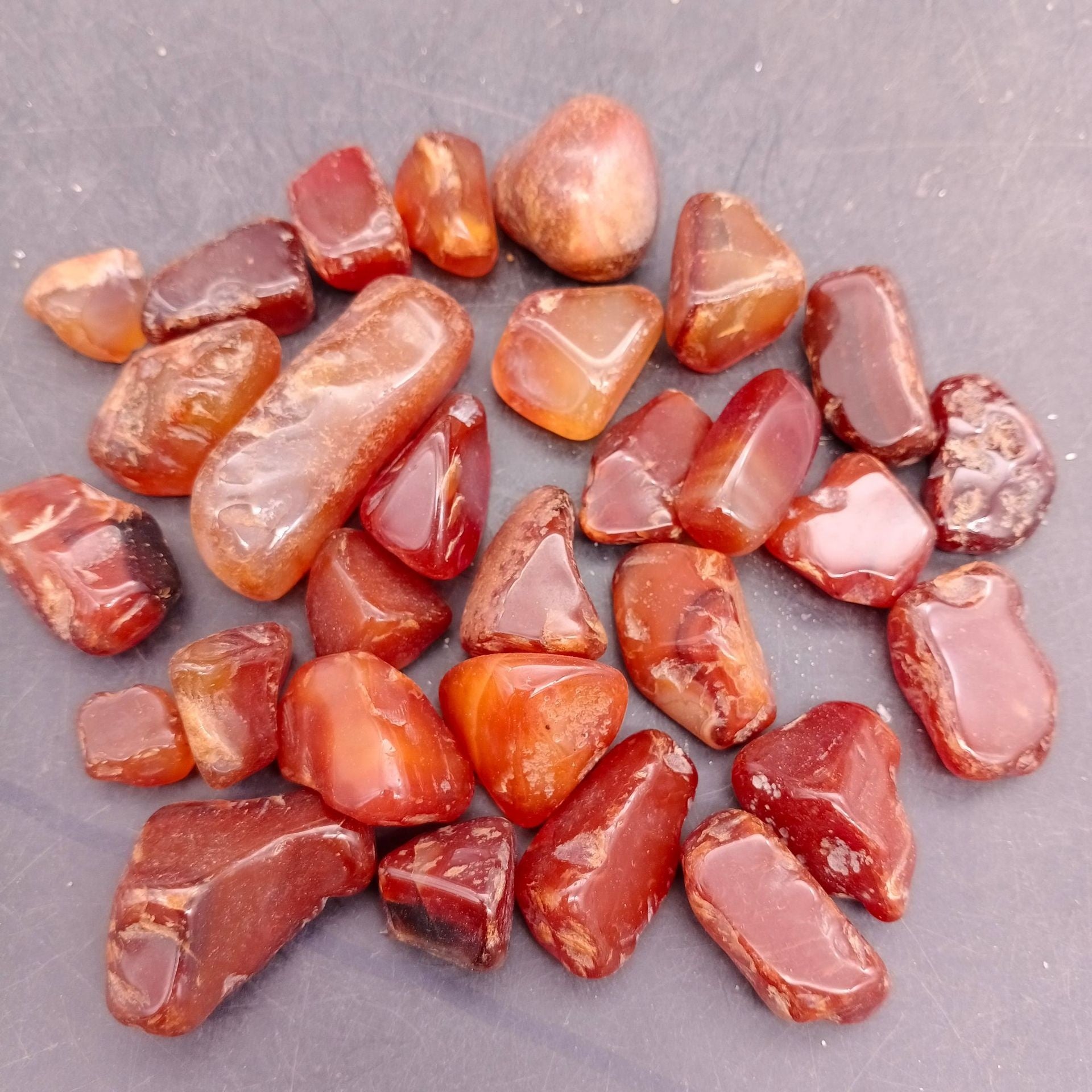 Tiger eye style tumbled stones with banded sheen for tabletop display