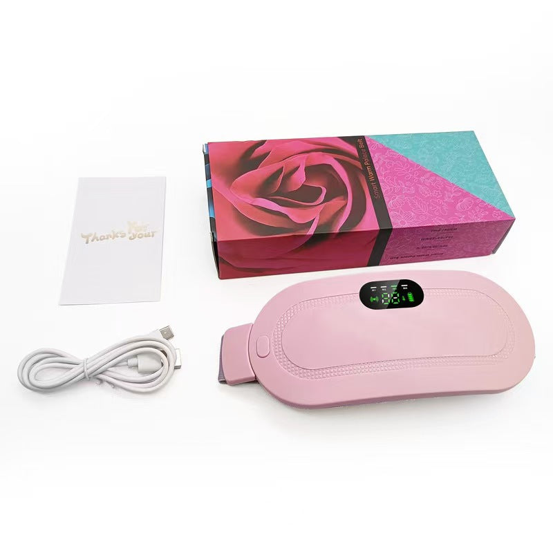 Pink heating belt beside a rose print box with a white USB cable and a thank you card