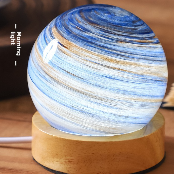 Dawn glass planet night light, pale blue and ochre swirl, label Morning light, printed box, USB powered, tri-color