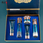 Open blue Hankey gift box holding a cleanser tube, two bottles, a cream jar and a BB cream tube in a fitted tray