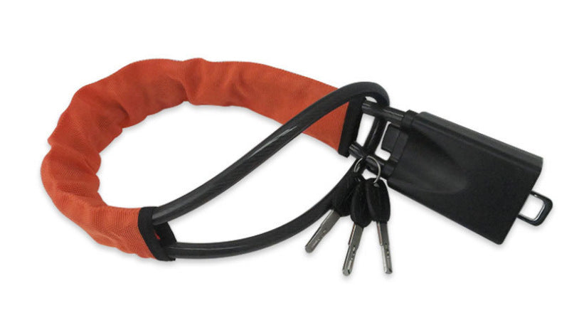 Braided steel cable steering wheel lock coiled with keys on a background