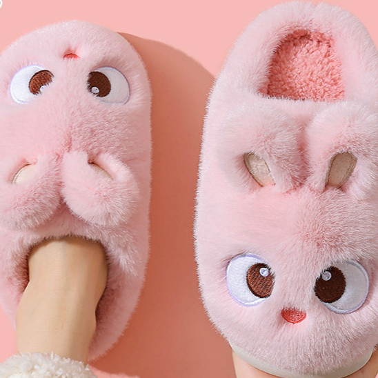 Pink cartoon bunny plush slippers seen from above on a foot, standard style, option photo for size 38/39