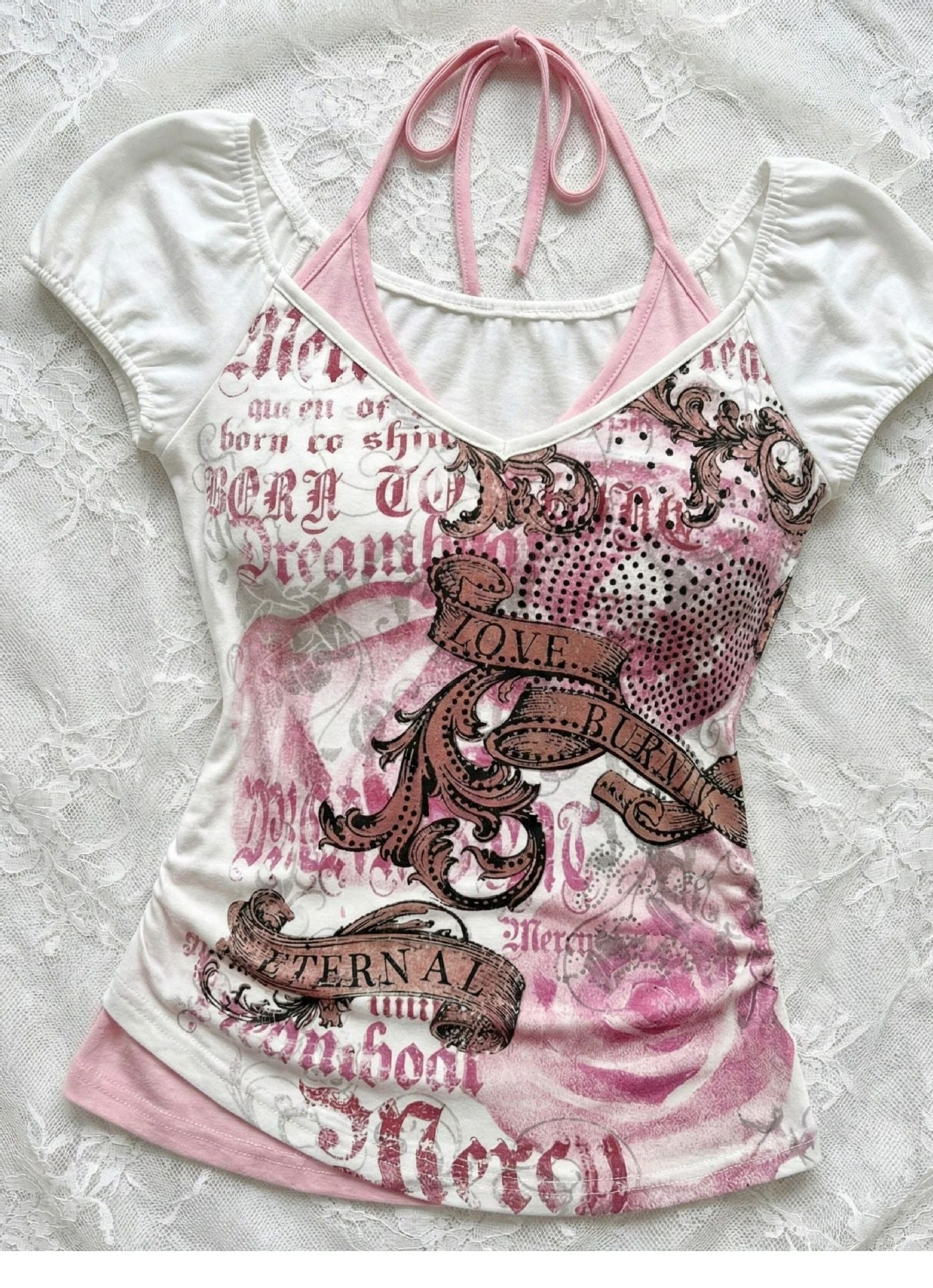 White printed tee with pink halter ties and a horse and scrollwork graphic front