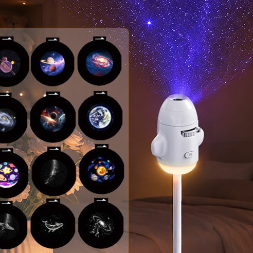 Lit USB star projector with a starry ceiling behind and a board of twelve slide discs