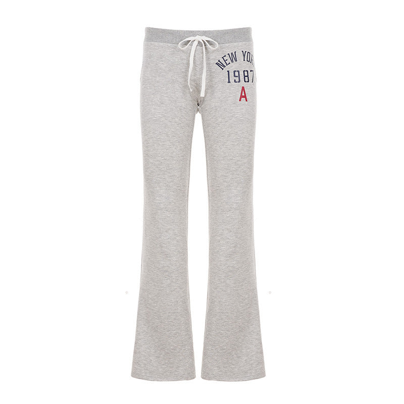 Grey heather low-rise flared bootcut sweatpants with drawstring and New York 1987 print flat