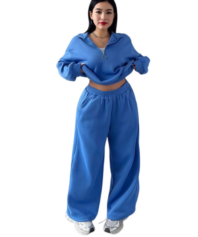Blue cropped half-zip sweatshirt and wide-leg sweatpants set on a model, size M option