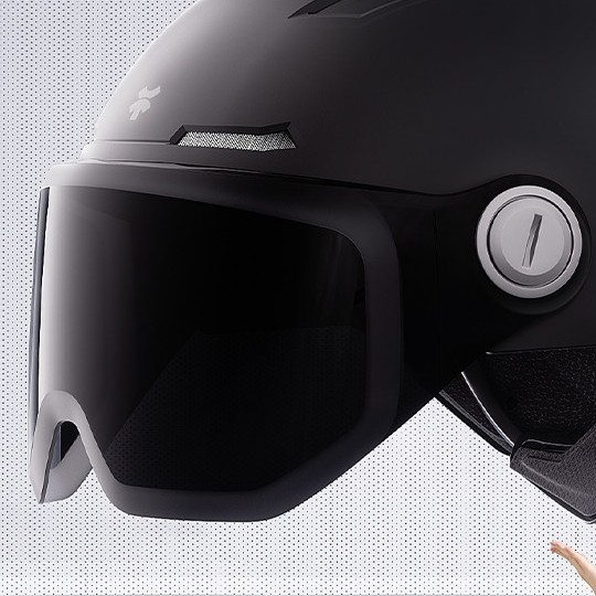 Side view of the half helmet showing the flip visor hinge and reflective side strip