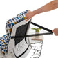 Hands looping the back tie strap of a geometric print cushion around a mesh office chair