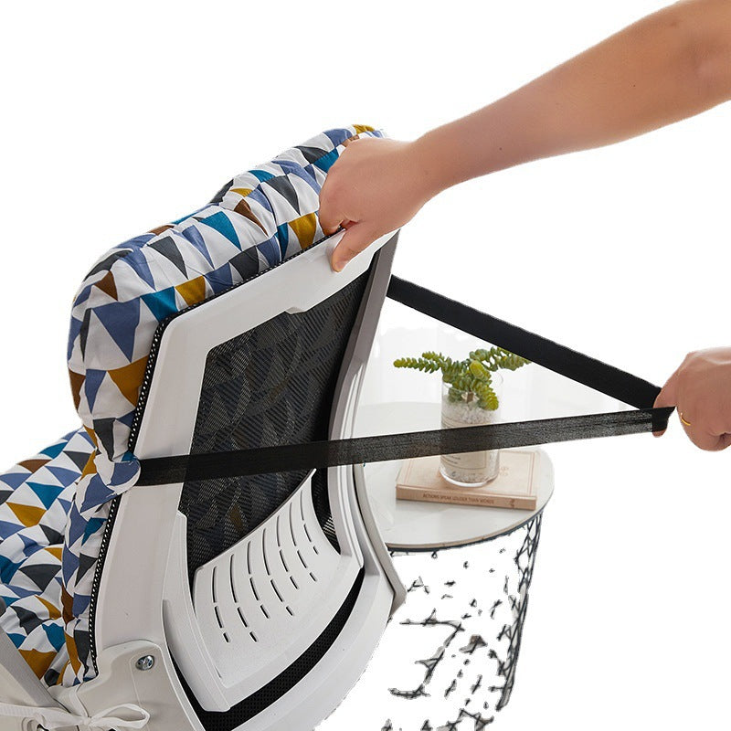 Hands looping the back tie strap of a geometric print cushion around a mesh office chair