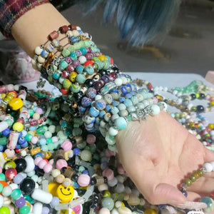 Side view of the ceramic beads strand showing rounded hand-shaped clay beads