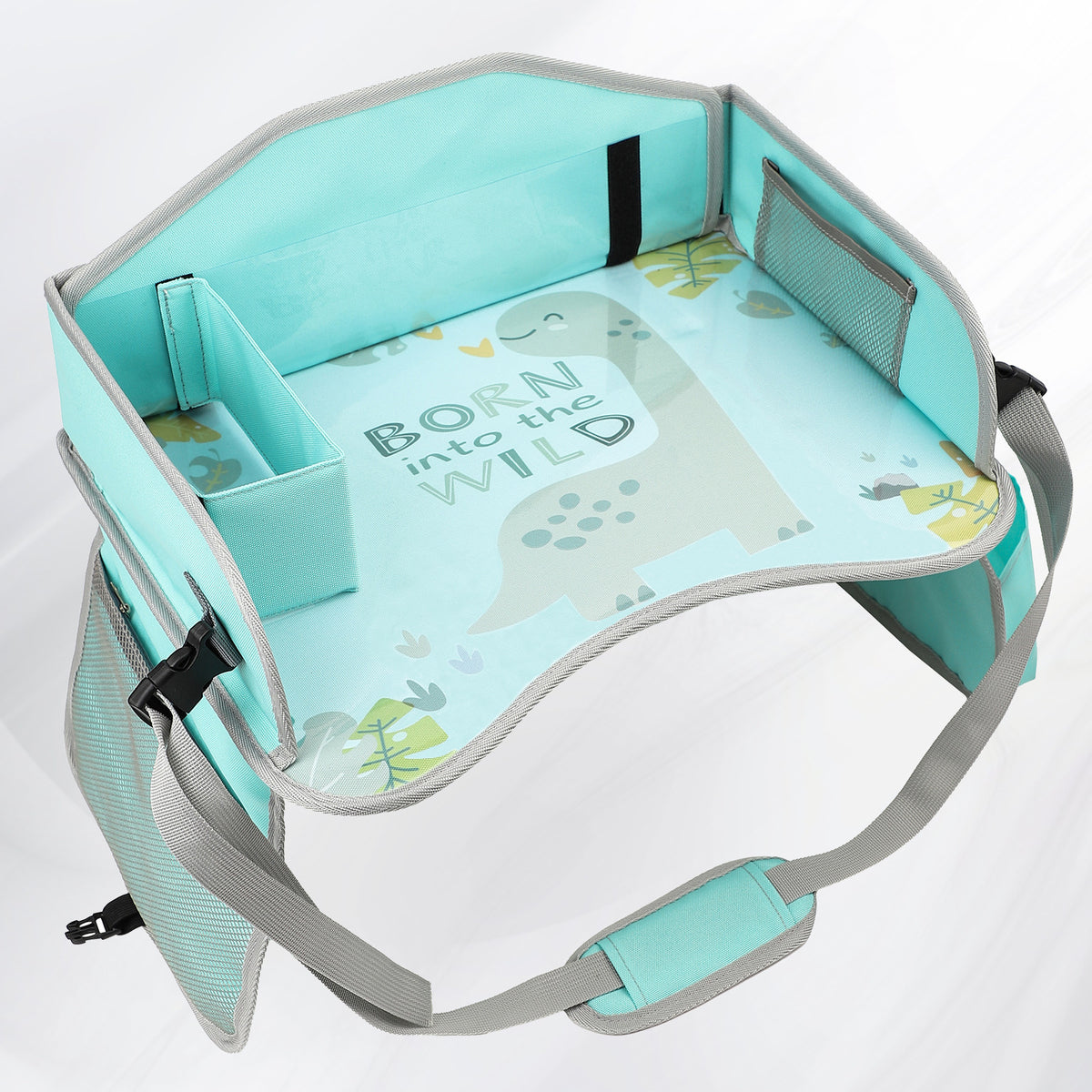 Mint Green Dinosaur kids travel tray with printed top, divider box, mesh pocket and strap