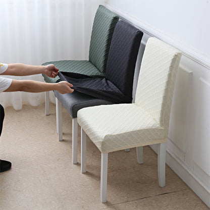 Green, dark grey and cream jacquard chair covers on three dining chairs