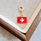 Switzerland enamel country flag keychain charm on a gold tone lobster clasp for keys and bags