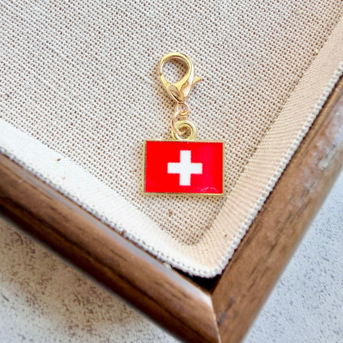 Switzerland enamel country flag keychain charm on a gold tone lobster clasp for keys and bags