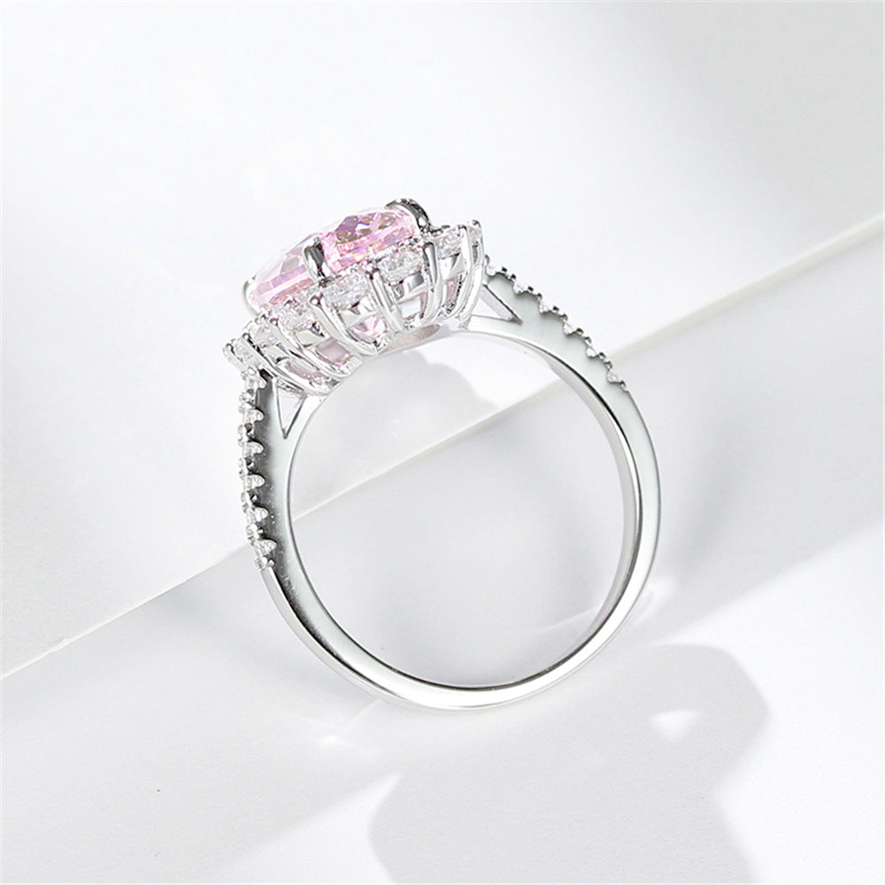 Side profile of the silver ring, raised open gallery head and a fine pave set shoulder band