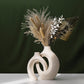 Matte speckled ceramic vase set, tall and short pieces side by side