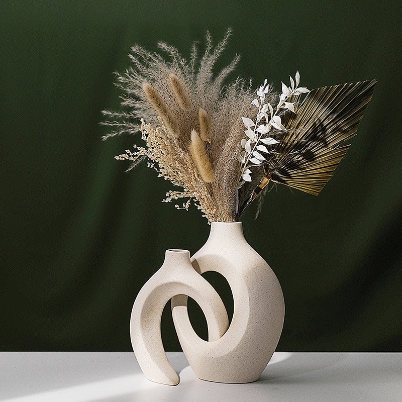 Matte speckled ceramic vase set, tall and short pieces side by side