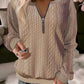 Womens cable knit quarter zip pullover with a mock neck and ribbed cuffs, front view