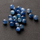 Scattered natural kyanite round beads in shades of blue for DIY jewelry making