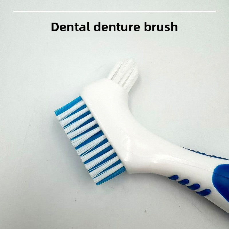 Close up of a blue denture brush showing the wide bristle head and the small tapered head on one handle