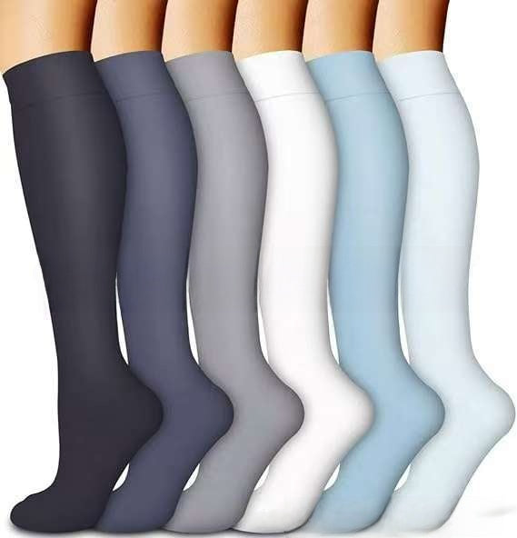 Assorted print knee high compression sport socks laid out side by side