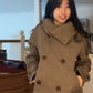 Front view of the short taupe wool blend coat with two rows of buttons closed